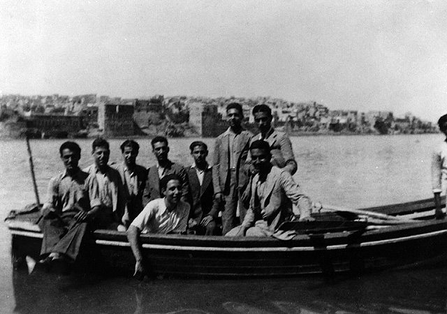 Group of young Jews who fled from Iraq to Eretz Israel following the pogrom in Baghdad in 1941. They reached Eretz Israel after considerable difficulties, were arrested by the British authorities, tried and sentenced to imprisonment, some were deported. Photo: Moshe Baruch, Ramat Hasharon. Beit Hatfutsot, the Oster Visual Documentation Center, courtesy of Moshe Baruch