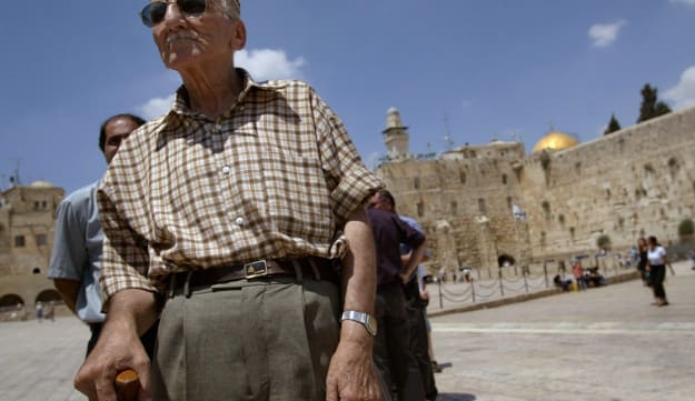 Ezra Levi, 82, left, during a visit to Jerusalem's Old City, July 2003. Levi was one of six elderly Iraqi Jews brought from Iraq in a secretive airlift earlier that month. 