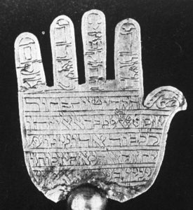 B&W image of a hand with written inscription on it 